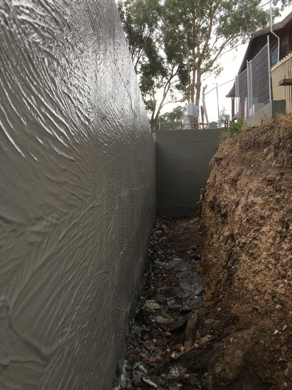 Waterproof membranes for retaining walls